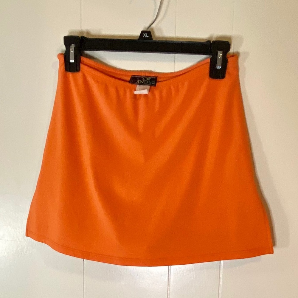 Bright orange y2k eye candy skort.